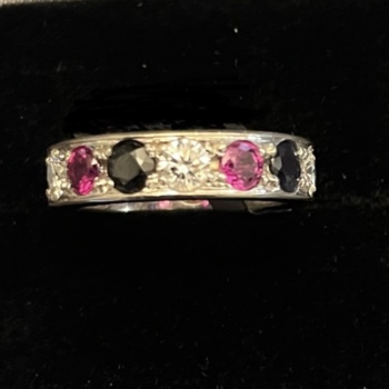 18ct white gold pre-loved diamond, sapphire and ruby set full eternity ring.