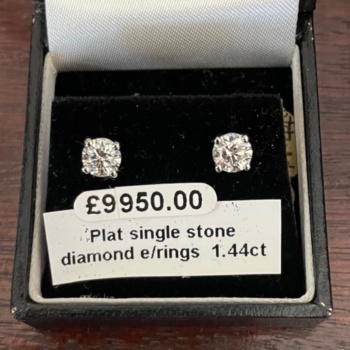 Platinum single stone diamond earrings. Round brilliant cut diamonds with total diamond weight of 1.44ct