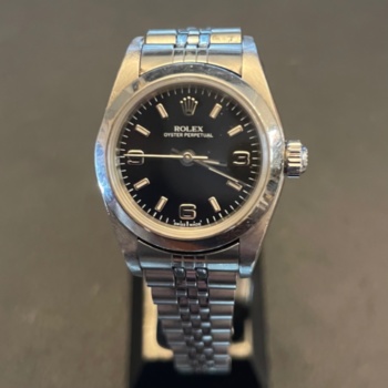 Ladies pre-loved Rolex Oyster Perpetual with black dial.
