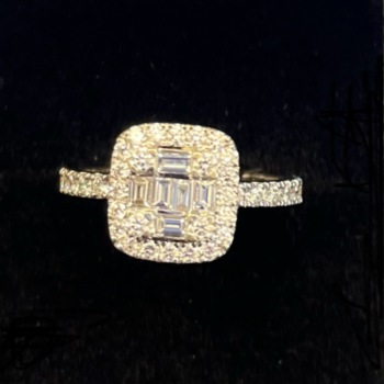 18ct white gold pre-loved baguette and round brilliant cut diamond ring.